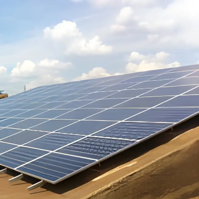 Solar panels on a rooftop under clouds.