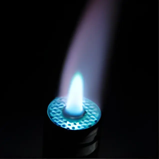 Blue flame from a lighter in darkness.