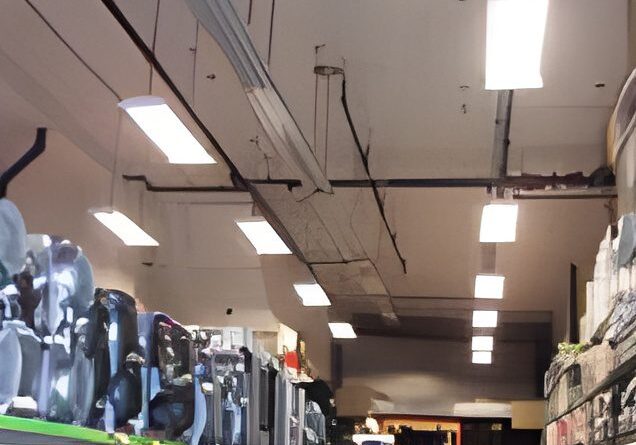 Store interior with appliances and ceiling lights.