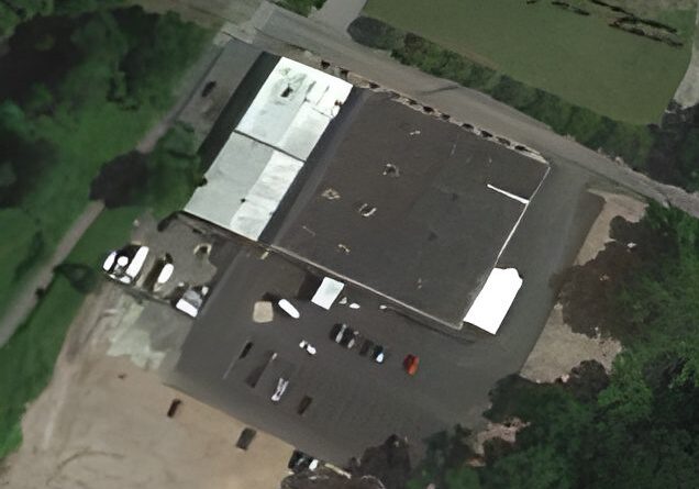 Aerial view of a large industrial building.