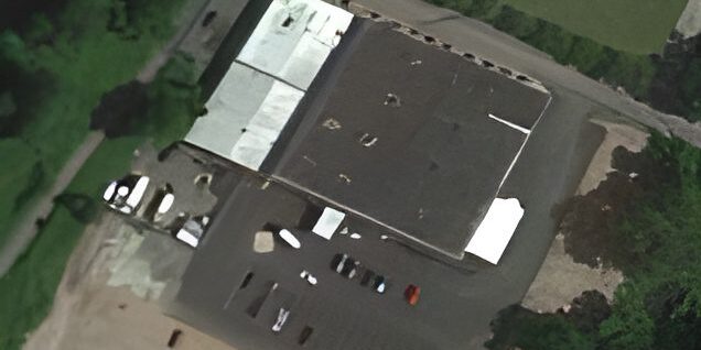Aerial view of a large industrial building.